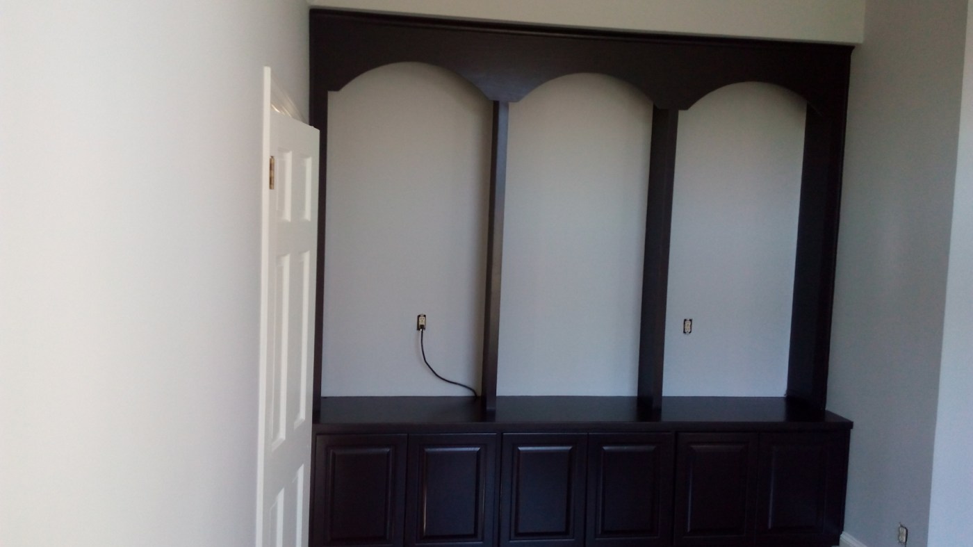 Built-in display cabinet refinished in a deep espresso tone