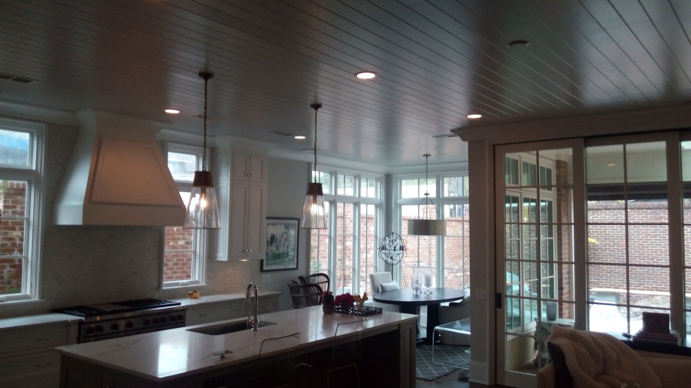 Kitchen and breakfast room with a freshly painted beadboard ceiling