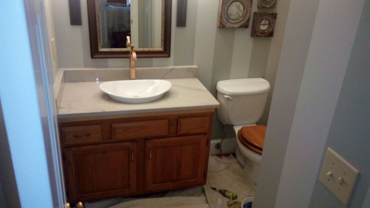 Powder room before: original oak vanity and bare walls