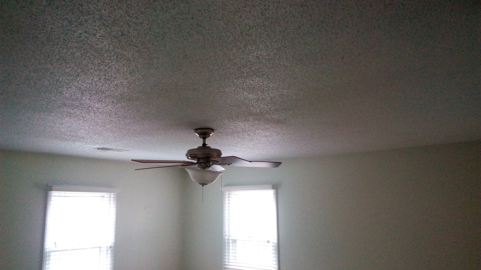 Bedroom ceiling and walls repainted with clean cut lines