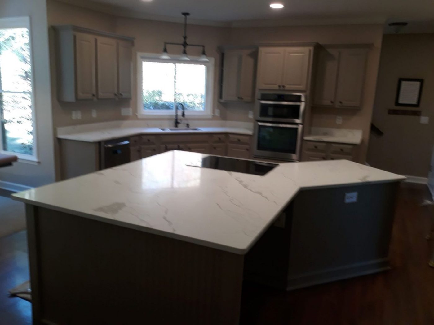 Kitchen cabinets and island refinished in soft greige